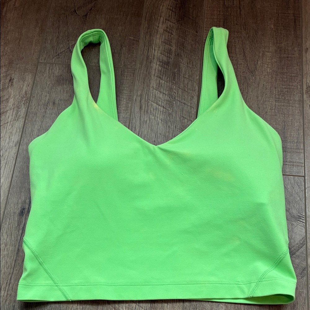Lululemon tank top with built in bra lime green has a couple of faded spots.